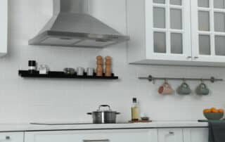 Discover clever range hood ideas for your kitchen with Action Air Duct—style meets function in this elegant and modern cooking space.