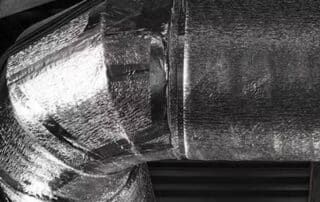 Insulated HVAC duct in industrial building